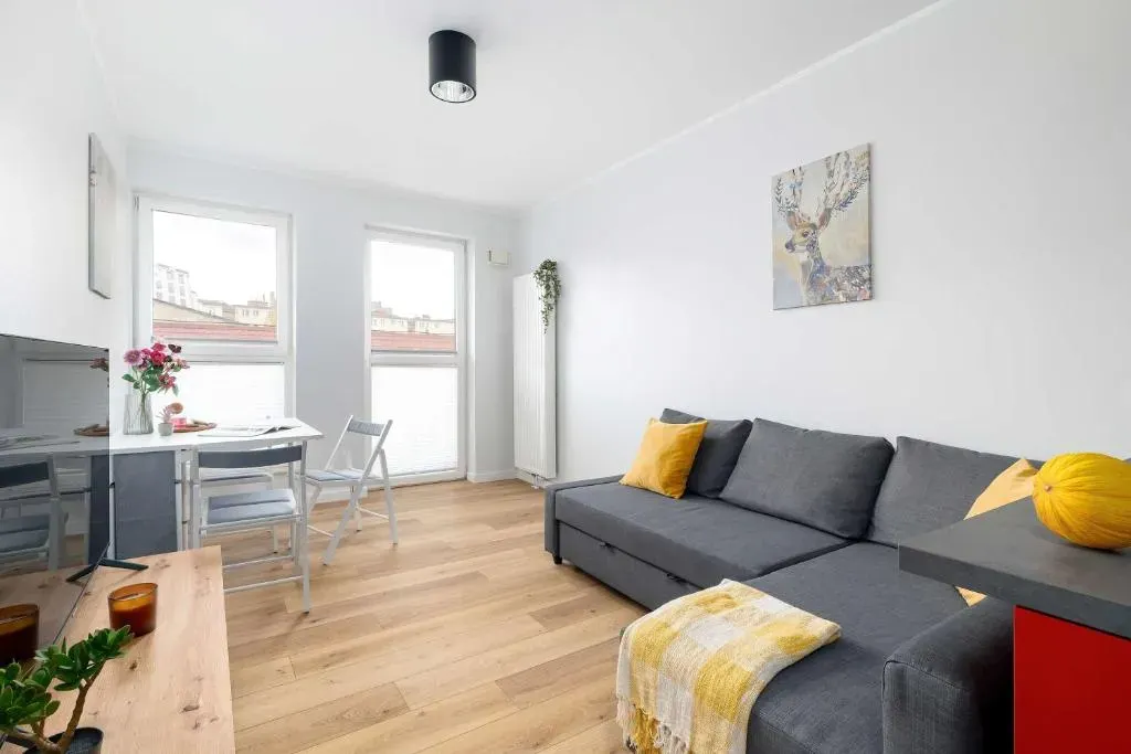 Red and Grey Apartment for 8 People in Poznań with Parking by Noclegi Renters, photo 1 of 10